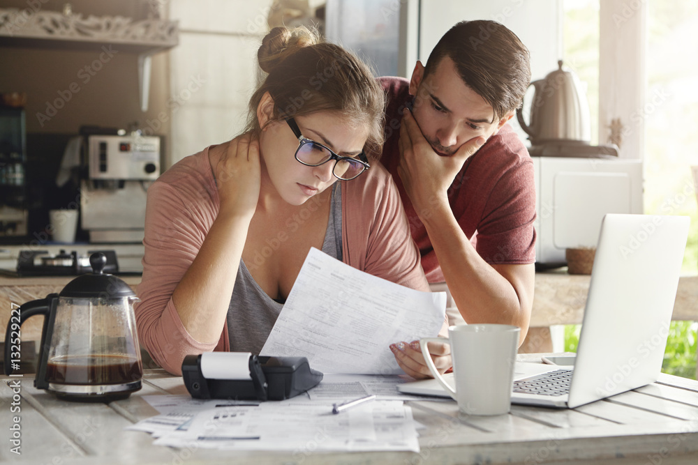 Family reviewing finances at home